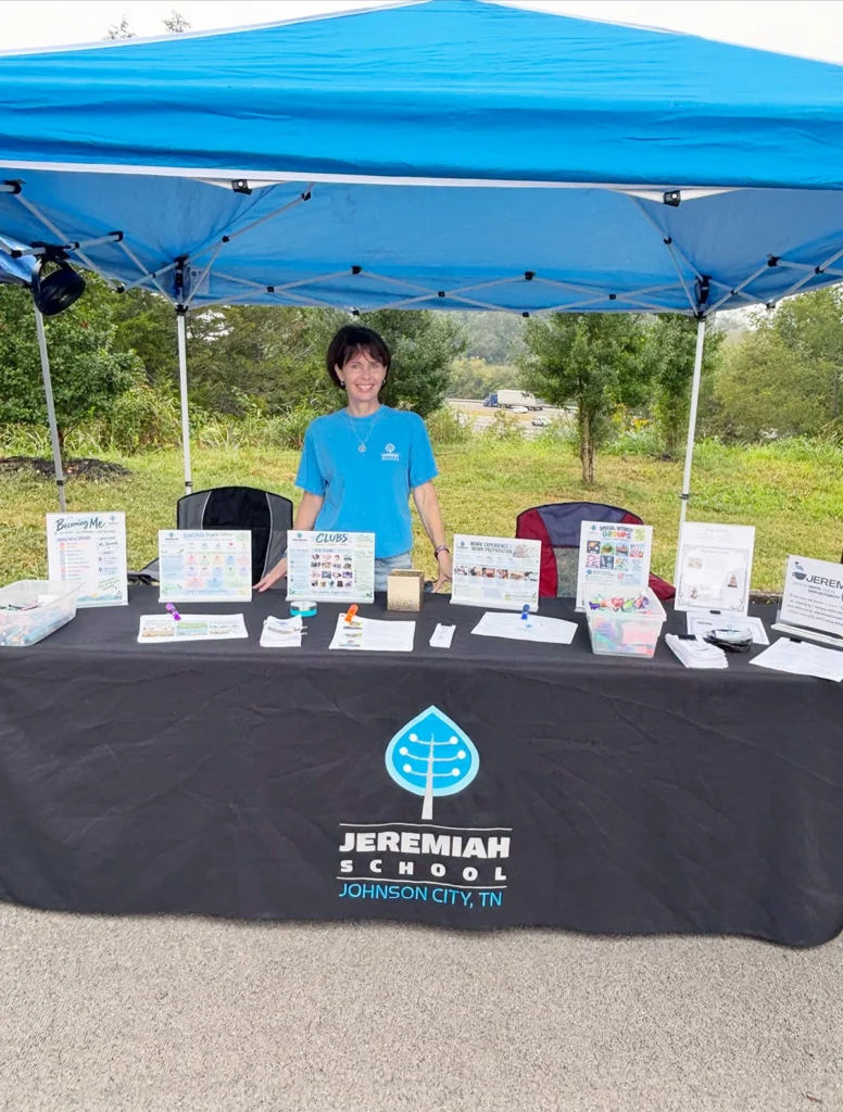 Jeremiah School representative sharing educational and life skills resources at the I CAN Special Needs Resource Fair